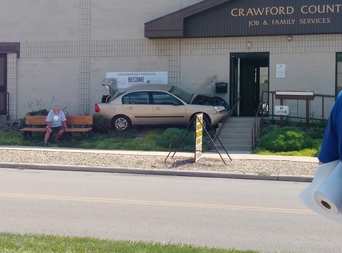 Vehicle hits county building, injures 1