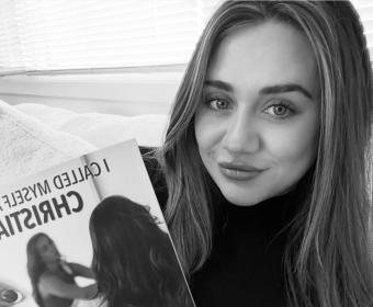 Picture of author Reegyn Maree holding her book.