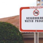 Warning sign for Neighborhood Watch Program, indicating crime prevention in the area