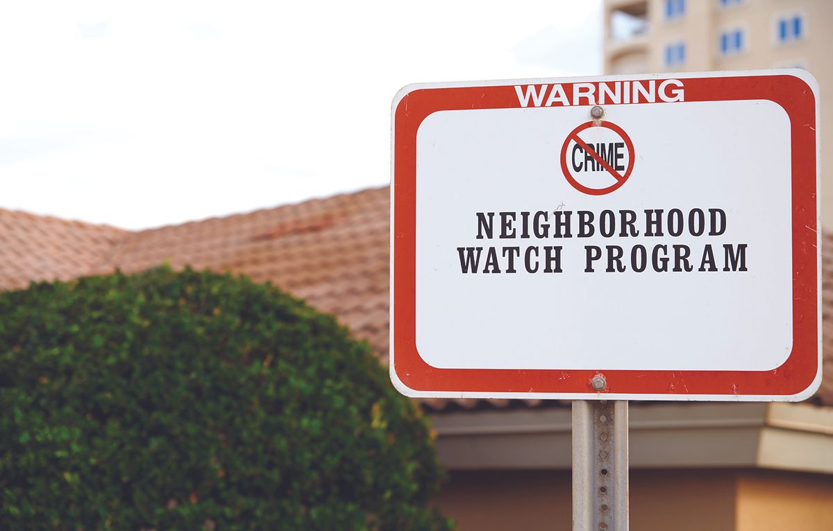 Warning sign for Neighborhood Watch Program, indicating crime prevention in the area