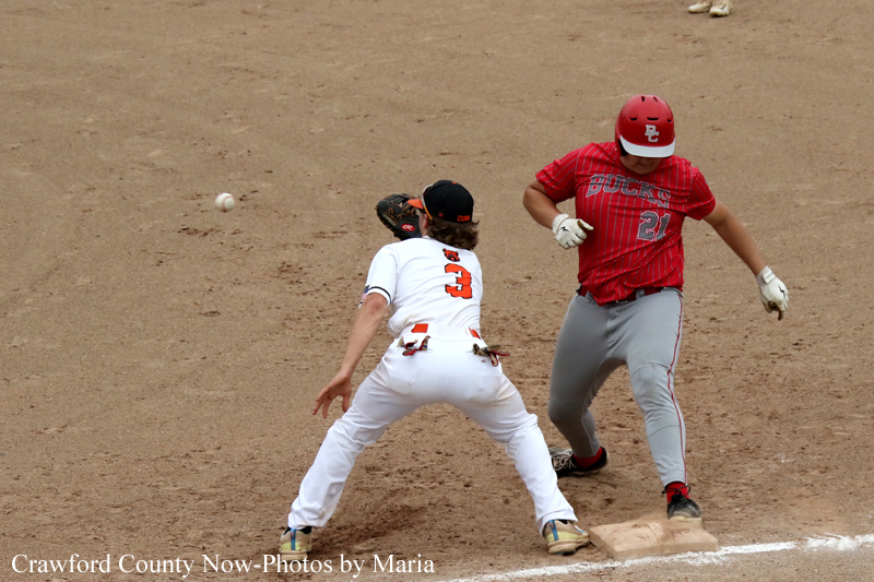 Baseball scene: runner in white slides into second base as a fielder in red covers the bag; ball is in midair nearby.
