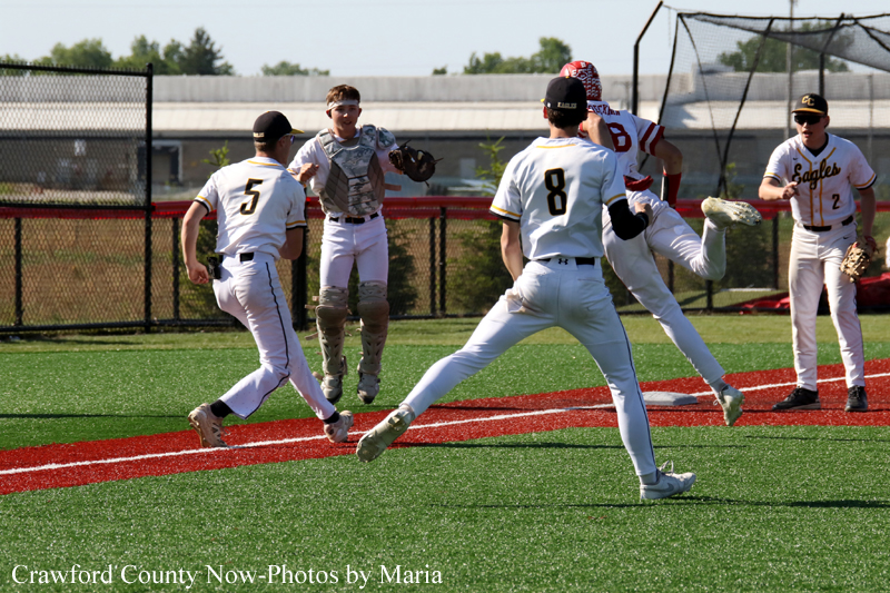 Baseball game: players sprint toward the infield as a catcher prepares to field a throw near home plate on a sunny field.