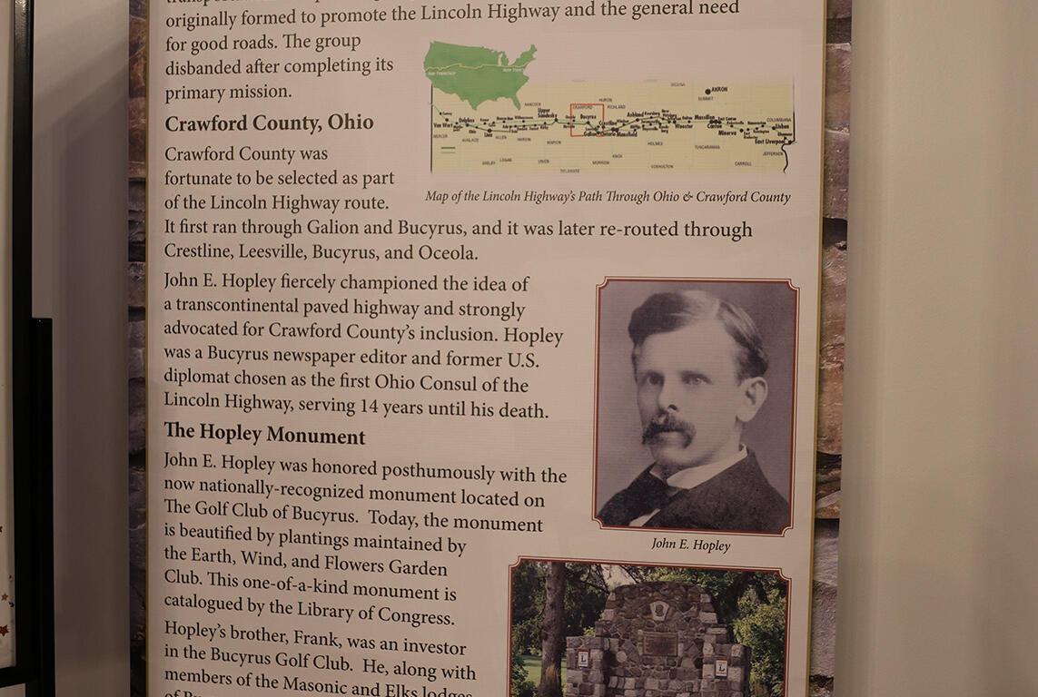 Poster-style informational panel about The Hopley Monument along the Lincoln Highway, with a map, portrait, and historical text.
