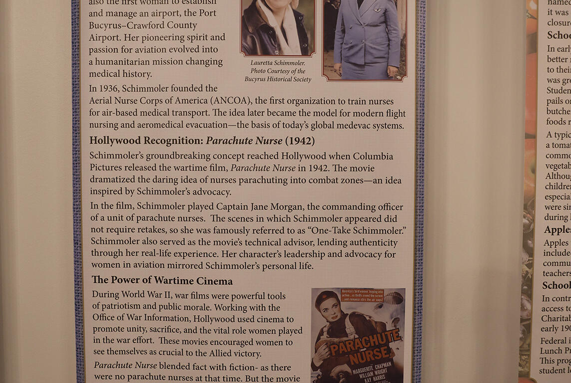 Banner about Parachute Nurse exhibit at Lauretta Schimmolor Museum, with photos of Lauretta Schimmoler and a nurse in uniform and text panels about WWII aviation history.