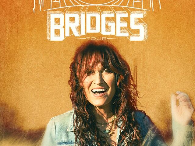 Promotional Bridges Tour poster with an orange background, a smiling woman in a denim jacket, and large BRIDGES text.