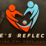 Logo for Love's Reflection: a heart formed by two stylized figures reaching toward a child, with the tagline 'Lighting the path forward' below.