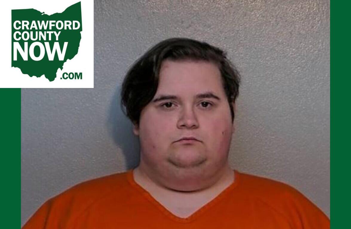 Mugshot of a heavyset man in an orange jumpsuit against a gray wall, with a Crawford County Now logo in the top-left corner.