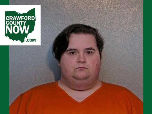 Mugshot of a heavyset man in an orange jumpsuit against a gray wall, with a Crawford County Now logo in the top-left corner.