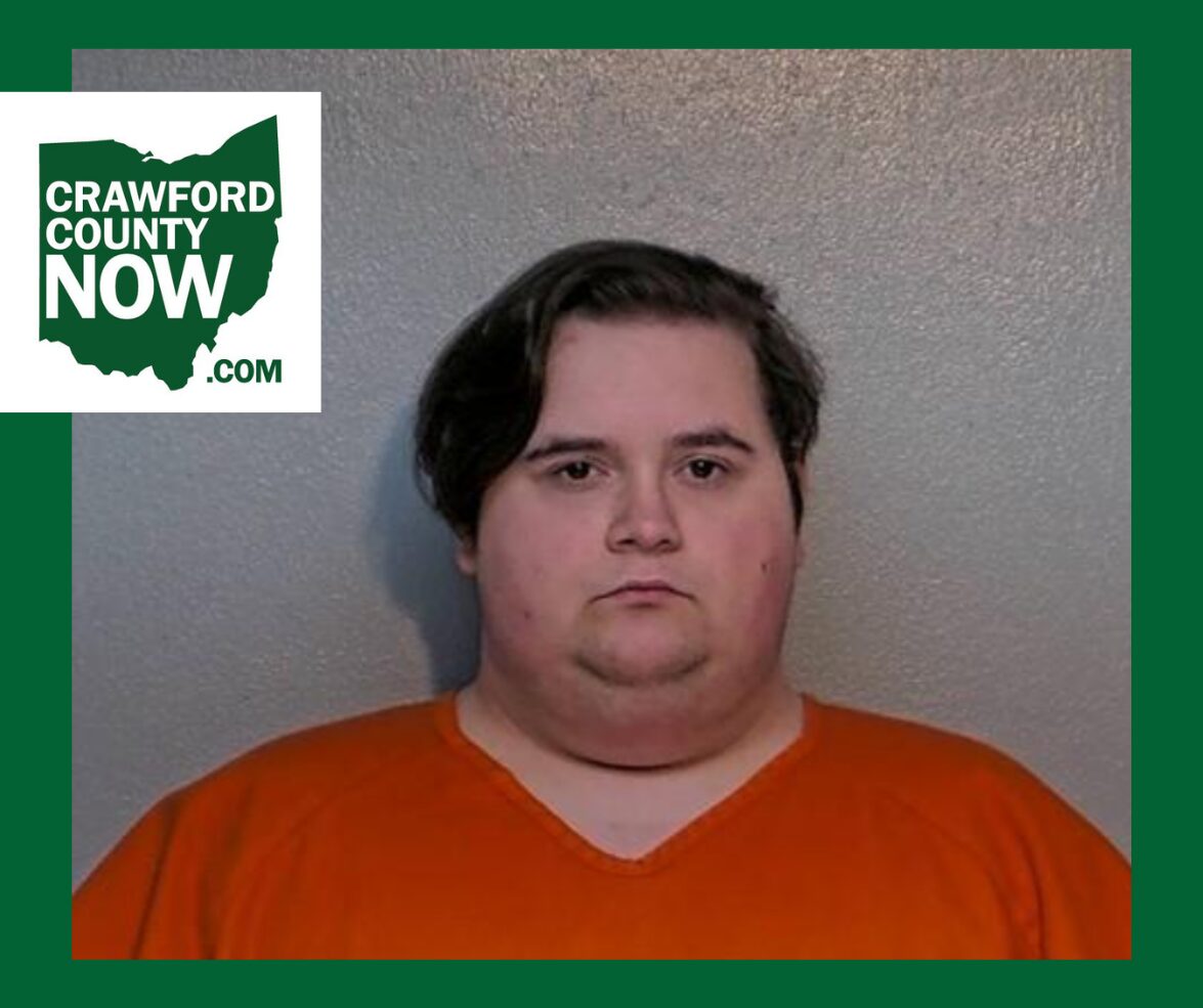 Mugshot of a heavyset man in an orange jumpsuit against a gray wall, with a Crawford County Now logo in the top-left corner.