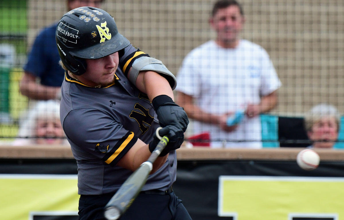 Baseball batter in gray uniform swinging at a pitch during a game