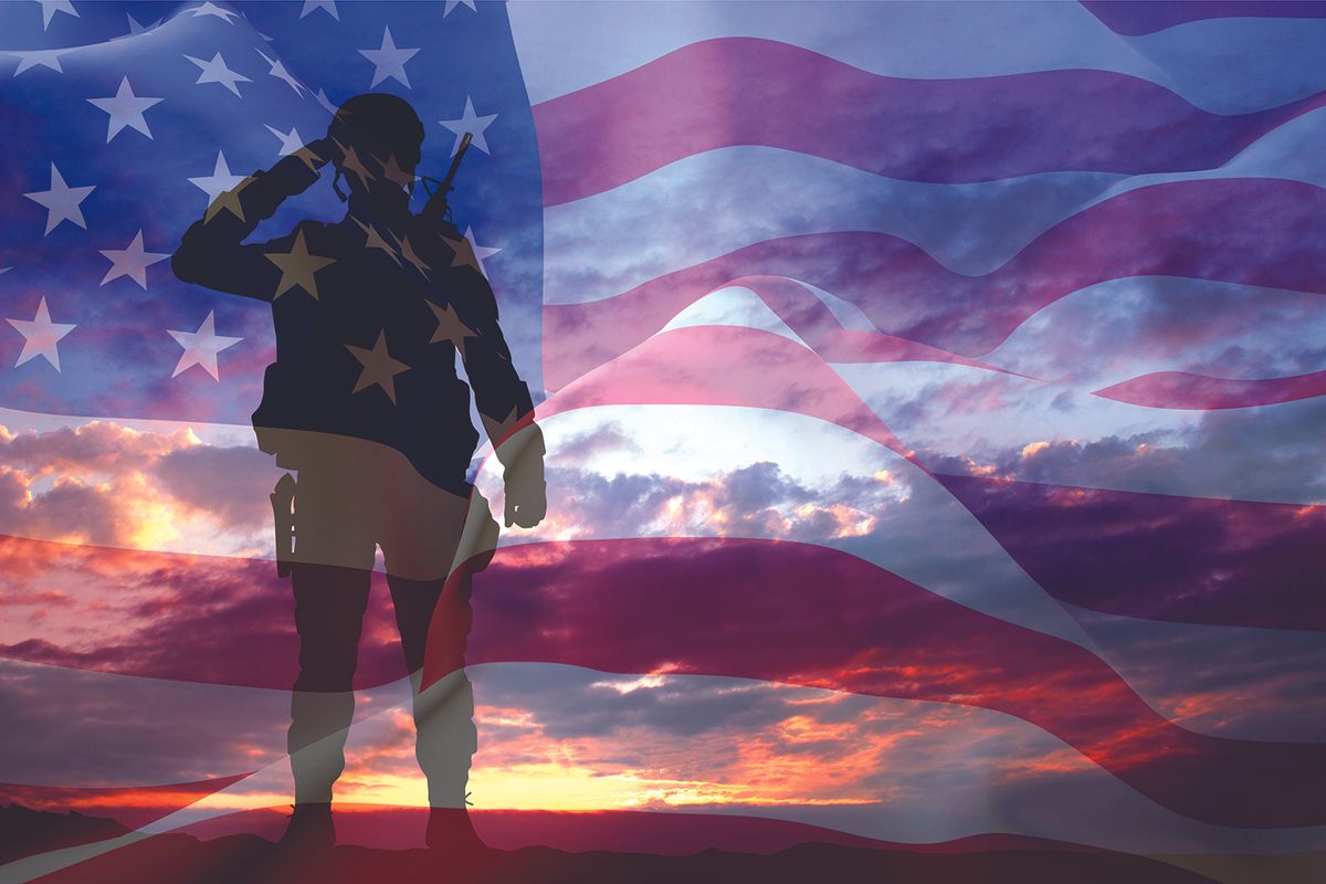 Silhouette of a soldier saluting with a rifle, overlaid on a waving American flag at sunset/dusk Вост.