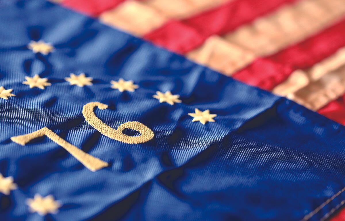 Close-up of blue EU flag fabric with yellow stars and the embroidered number 10.