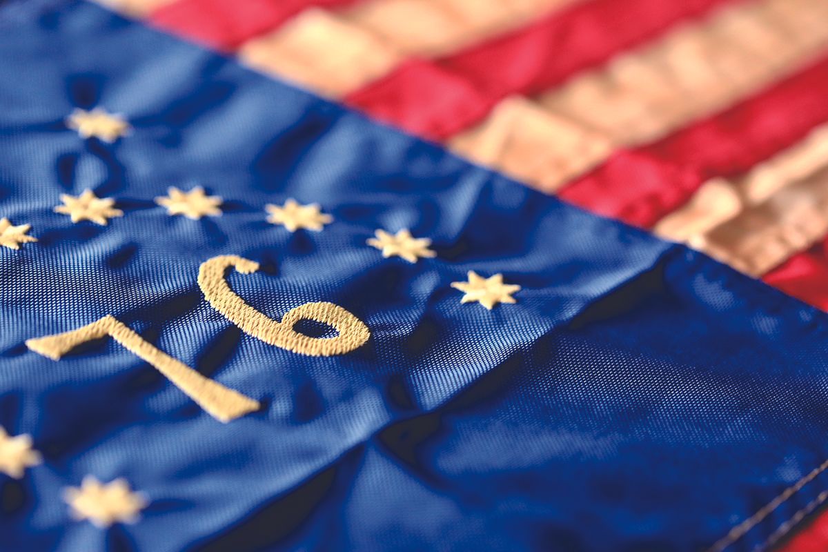Close-up of blue EU flag fabric with yellow stars and the embroidered number 10.