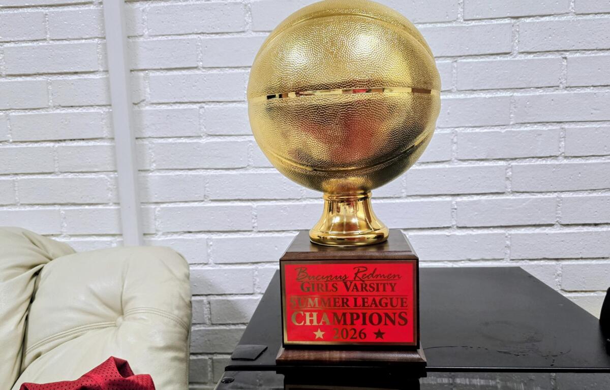 Gold basketball trophy on a wooden base with a red plaque that reads 'Bruins Redmen Girls Varsity Summer League Champions 2026'.