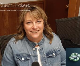 Portrait of Christi Eckert smiling in a denim jacket, for the Community Spotlight feature of the Marion-Crawford Prevention Program.