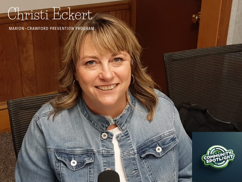Portrait of Christi Eckert smiling in a denim jacket, for the Community Spotlight feature of the Marion-Crawford Prevention Program.