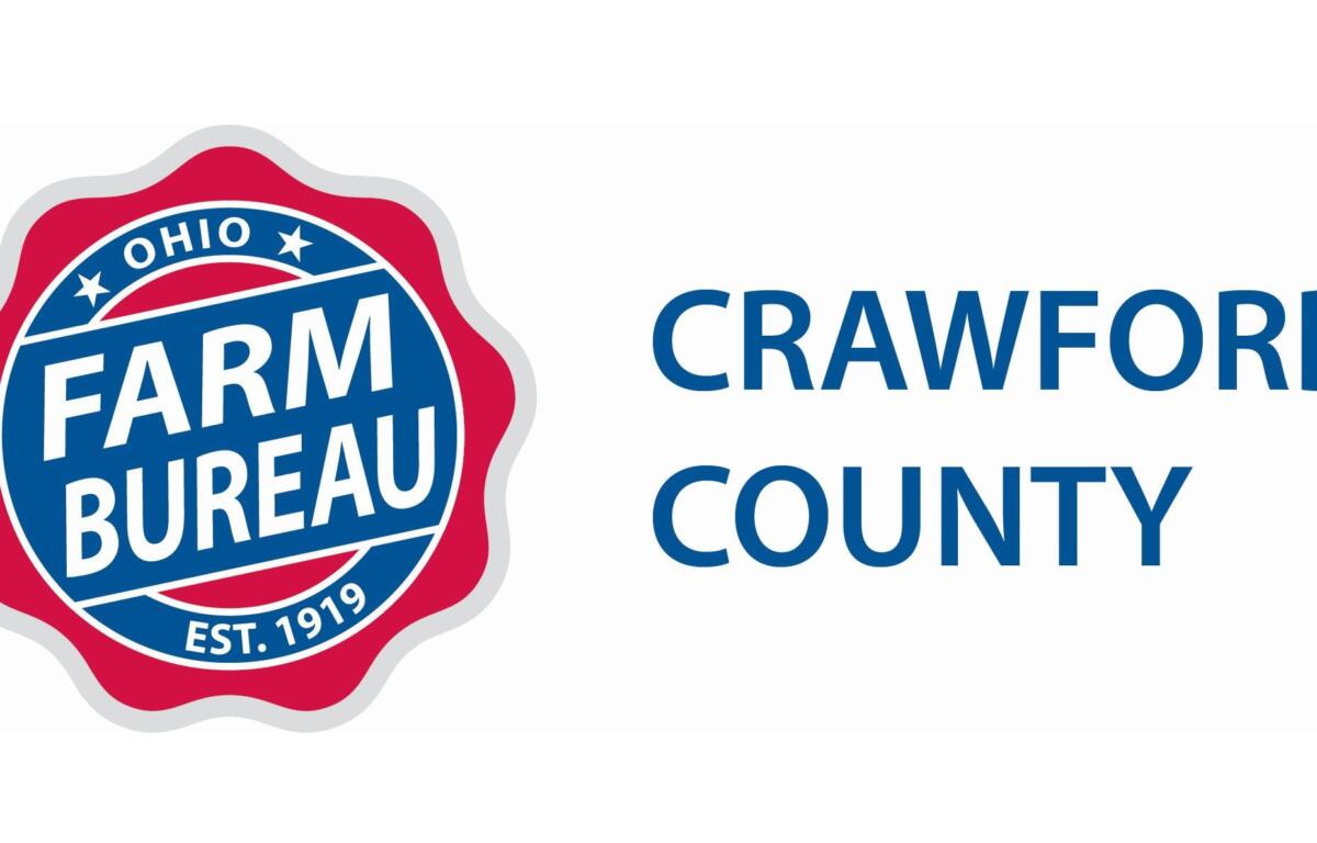 Ohio Farm Bureau seal on the left with a red badge and blue interior, and the words 'CRAWFORD COUNTY' in blue on the right.