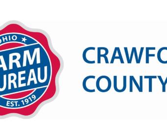 Ohio Farm Bureau seal on the left with a red badge and blue interior, and the words 'CRAWFORD COUNTY' in blue on the right.