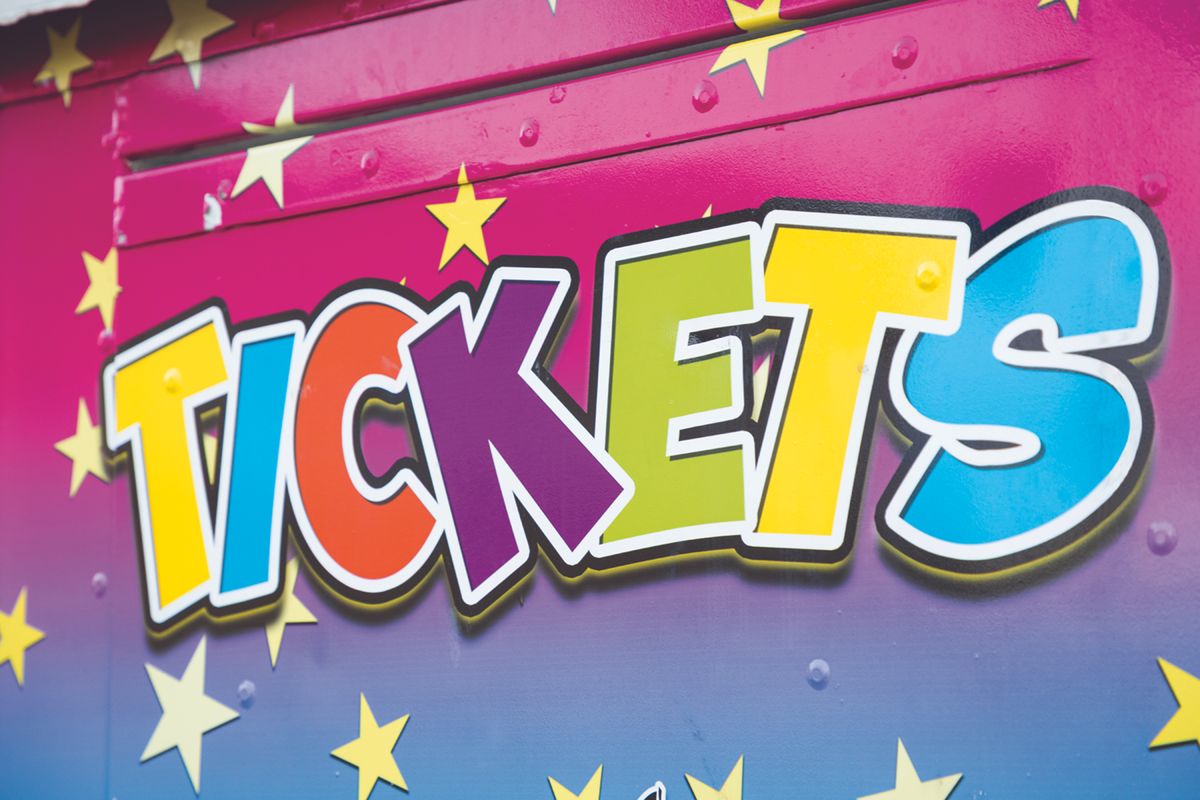 Colorful graffiti-style lettering that spells 'TICKETS' on a pink-to-blue backdrop with yellow stars.